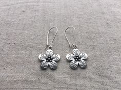 "Here are some pretty and unique flower dangle earrings. They are so sweet and would be perfect for everyday wear. Theses earrings would also make the perfect little gift for someone special. Made from allergy free plated silver. They measure 5/8\" across by 5/8\" long and hang from 1\" kidney style ear wires. Overall length is 1 5/8\" long. I have a matching necklace in my store if you would like the whole set. Here is a direct link https://etsy.me/317bnO3 Thanks for stopping by! Please take a Whimsical Adjustable Flower Charm Earrings, Nickel-free Bohemian Flower Earrings, Bohemian Flower Shaped Earrings, Bohemian Hypoallergenic Flower Earrings, Bohemian Flower-shaped Pierced Earrings, Whimsical Drop Earrings With Flower Charm, Whimsical Nickel Free Dangle Flower Earrings, Bohemian Flower Earrings Nickel Free, Bohemian Flower Charm Drop Earrings