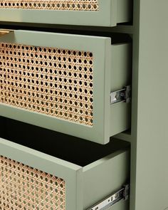 two drawers with wicker inserts on each side and one drawer closed to the other