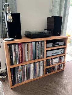 Unique chunky record storage cabinet with shelves.  Vinyl storage gaps - 34cm high. Unit pictured: Hemlock finish , 120cm. Stand made from scaffold-style solid wooden boards. Designed and hand crafted in Cheshire,UK. All of our items are made in weathered , rustic style and feature such characteristics as knots, cracks, scrapes etc.  Delivery: Units are usually delivered by UPS or TNT couriers. Transit time is 2-3 days for UK. Within the Europe, transit time is 3 to 5 working days. Dimensions: H Storage Cabinet With Shelves, Cheshire Uk, Record Storage Cabinet, Single Storey Extension, Cabinet With Shelves, The Europe, Storage Cabinet Shelves, Wooden Boards, Vinyl Record Storage