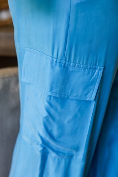 Get ready to strut your style this spring with our Laura cargo pants! With a gorgeous electric blue shade, these pants will add a pop of color to any outfit. Plus, their cargo design provides plenty of pockets for all your essentials. Step out in style and functionality with Laura! 100% Rayon Color: Flat Blue with Shimmer Button/ Zipper Closure Multi Pockets Half Elastic Waist BAND Light Weight Utility Cargo Style Straight Leg Belt Loops True to size Model is wearing a size Small. She is 5'6". 1 Blue Relaxed Fit Wide Leg Cargo Pants, Blue Wide Leg Relaxed Fit Cargo Pants, Blue Wide Leg Cargo Pants With Relaxed Fit, Blue Tapered Leg Pants With Side Pockets, Blue Relaxed Fit Utility Bottoms, Blue Straight Leg Utility Parachute Pants, Blue Straight Leg Parachute Pants In Cargo Style, Blue Straight Leg Cargo Parachute Pants, Blue Utility Parachute Pants With Straight Leg