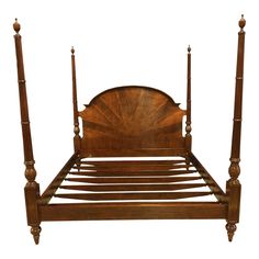 a wooden bed with four posts and no headboard or foot board is shown against a white background