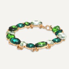 Make a statement with this green jewel bracelet. Perfect for adding a little extra colour to a plain outfit.Features different cool hues of green in mixed-cut shapes. Pair with another piece in our Iris range for ultimate sparkle. Gold-Tone Plated | Nickel, Lead, and Cadmium Free Product Code: DB2132C Collection: Iris Type: Clasp Material: Base Alloy Metal & Crystal Dimensions: Length 18-22cm Pendant Dimensions: Style: Contemporary, Statement, & Geometric Includes: Elegant Green Faceted Crystal Bracelet, Jewel Bracelet, High Street Shops, Gold Armband, Clasp Bracelet, Free Product, Bracelet Clasps, Keep Jewelry, Green Crystals