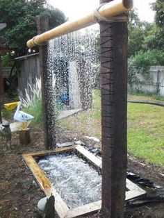 an outdoor shower with water coming out of it