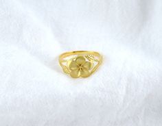 Discover our lovely Plumeria Flower Ring, made from durable 925 sterling silver and gently gold plated. This unique Hawaiian jewelry piece showcases a pretty plumeria flower design, perfect for everyday wear or special occasions, bringing a touch of island beauty to your style. Yellow Flower Jewelry For Anniversary, Yellow Flower Ring For Wedding, Yellow Gold Birth Flower Rings, Yellow Gold Flower Ring With Birth Flower Detail, Yellow Flower Wedding Rings, Gold Flower-shaped Ring For Gift, Gold Flower Shaped Ring For Gift, Gold Flower-shaped Promise Ring, Yellow Flower Ring For Anniversary