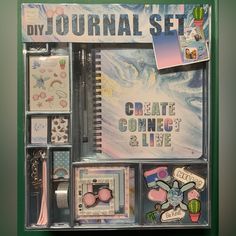 a blue box with various items in it and the words, diy journal set