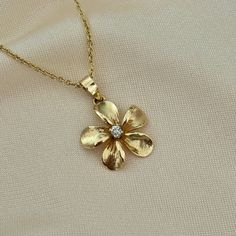 - Stamped 14k solid yellow gold - Plumeria flower - 2 gemstone options: Genuine 0.07 ct diamond or cubic zirconia - Comes with a 14k gold chain option (shown in photos) : 18 inches long and 1.5 mm thickness  with a round clasp -  Gorgeous florentine and satin finish  - Pendant dimensions : 17 mm x 17 mm (wxh) - Pendant weight : 2.2 grams - Makes the perfect gift Gold Diamond Flower Necklace, Diamond Flower Necklace, Xoxo Jewelry, Jewelry Accessories Ideas, Dope Jewelry, Flower Pendant Necklace, Funky Jewelry, Girly Jewelry, Dream Jewelry