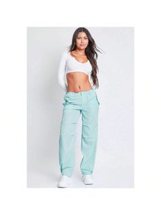 Getting dressed is a cinch with our Women's Relaxed Fit Nylon Parachute Pants. These high-waisted nylon pants feature a relaxed, slouchy fit for a cool look and comfy feel. Features bungee ties at the waist and hem for optional cinching, a front zip fly with hidden button closure, and snap button flap pockets at the front and back. Detailed with subtle layered pleats on the front. Style this pant with a fitted top and sneakers for a sporty-chic vibe. 

Product Details
- High Rise 
- Front Zip Fl Spring Outdoor Parachute Pants, Spring Outdoor Solid Color Parachute Pants, Solid Color Parachute Pants With Cargo Pockets For Spring, Spring Solid Parachute Pants With Cargo Pockets, Trendy Summer Cargo Pants For Outdoor, Sporty Solid High-waisted Parachute Pants, Sporty High-waisted Parachute Pants, Wide Leg Nylon Bottoms For Fall, Spring Nylon Pants With Cargo Pockets