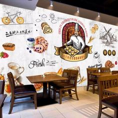 a restaurant wall mural with an image of a chef and various pastries on it