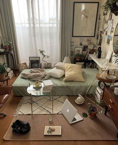 a living room filled with furniture and lots of clutter on top of the floor