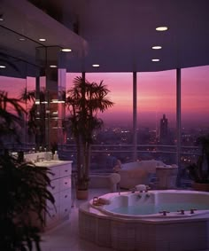 a large jacuzzi tub sitting in the middle of a living room next to a window