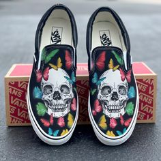 These black slip on Vans offer a custom skull and rainbow butterfly design. Get this design on white Vans: https://bit.ly/3OWqWQ0 We source each pair of blank shoes brand new directly from Vans. The ink is permanent and will never come off. Made in the USA. This price includes everything: shoes and artwork. Custom Vans Slip On Bad Bunny, Coustmize Vans, Monster Energy Custom Shoes, Custom Vans With Name, Drawn On Shoes For Men, Luxury Low-top Custom Sneakers For Skateboarding, Funny Shoes Custom, Custom Vans Sun And Moon, Custom Vans Slip On Lv