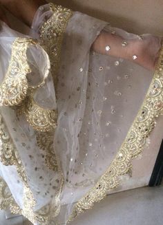 More dupatta here in our collection https://www.etsy.com/shop/neelcreations/?section_id=15880219White with embroidery Indian dupatta.It has beautiful golden border. Scallop border with dull gold color.★ The mirror is not real.★ It can be made in other colors and longer in length also.We can also change the border if you want.Approximate length 88-90 inches. We can increase length so please contact us if you want longer dupatta.These designer dupattas are very much in trend. Pair them with plain White Bridal Dupatta, Net Dupatta Designs, Unique Wedding Veils, Wedding Dupatta, Indian Dupatta, Embroidery Indian, Sarees Traditional, Muslim Bridal, Bridal Dupatta