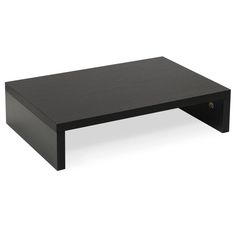 a black coffee table sitting on top of a white floor