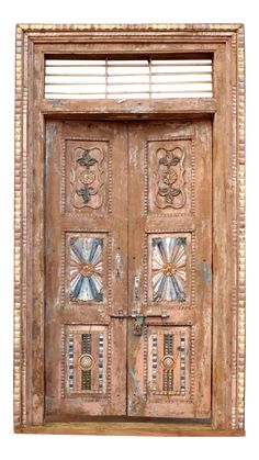 an old wooden door with decorative designs on it