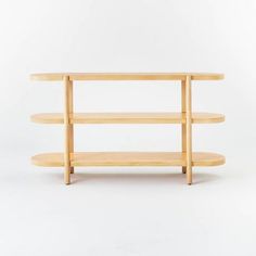 three tiered wooden shelf against a white background with no one in it's place