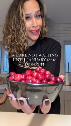 a woman holding a bowl full of apples with the caption we are not waiting until january 1st to die