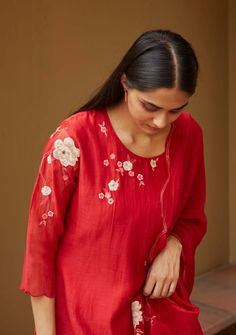 Editor's Note This Kurta Set Features An Asymmetric Play Of Floral Appliqué And Skilled Thread-work. This Look Is Complete With Sheer Lace Panel Bottoms And A Scallop-edged Dupatta With Tassels That Elevate The Ensemble. Color: Red Fabric: Muslin Cotton Care: Dry Clean Only About the Designer Vaayu stems from the new ethos of thoughtful and personal design which connects the wearer to the maker. We work closely with craftsmen and weavers across the country to create conscious clothing for everyd Applique Kurta, Scallop Dupatta, Applique Work, Kurta Set For Women, Embroidery On Kurtis, Kurti Embroidery Design, Elegant Blouse Designs, Kurta Designs Women, Hand Embroidery Design Patterns