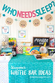 a table topped with waffles and other food items next to a sign that says who needs sleep?