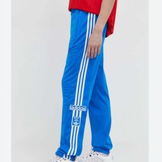 Nwt Men's Adidas Snap Track Style Pants. It Has Snaps Down The Sides, Drawstring Waist, And Has 2 Front Zip Pockets. Style Is Regular Fit. Blue Sweatpants With Three Stripes For Streetwear, Adidas Relaxed Fit Pants With Three Stripes, Adidas Blue Relaxed Fit Bottoms, Adidas Blue Streetwear Pants, Blue Adidas Streetwear Pants, Adidas Blue Cotton Bottoms, Adidas Wide Leg Cotton Pants, Blue Cotton Adidas Bottoms, Adidas Cotton Long Pants