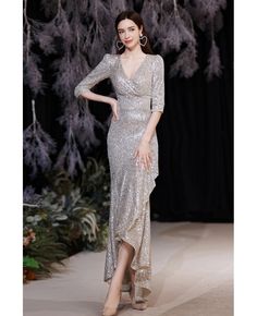 Buy silver sequined vneck elegant mermaid party dress with half sleeves at wholesale price online. Free shipping and pro custom service since 2009. Long Formal Dresses Elegant Silver, Luxury Gray Dresses For Festive Occasions, Luxury Elegant Dress With 3/4 Sleeves, Silver Dress Formal Sleeves, Silver Dress Formal Modest, Silver Dress For Older Women, Silver Winter Dress For Wedding Guest, Luxury Evening Dress With Butterfly Sleeves, Luxury Silver Dress For Banquet