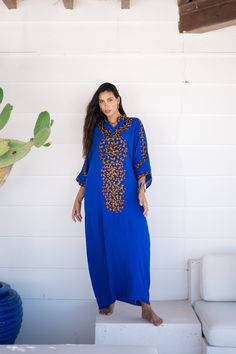 *Note : The kaftan in the video is a different color and is only displayed to show the fit, flow, and cut of the Kaftan. You will receive the one in the pictures.* A bohemian flash caftan made of light mesh of linen and poly, the fabric is unique in that it's very flowy and not the usual feel and touch of linen. This Kaftan is ideal to wear for any casual occasion. Whether taking a trip down the shopping lane, or home-based kitty parties, or about anything else, wearing this dress will make you Blue Dress With Embroidered Border For Festival, Festive Royal Blue Kaftan, Blue Resham Embroidered Maxi Dress, Blue Maxi Dress With Resham Embroidery, Blue Floral Embroidered Tunic Kurta, Festival Maxi Length Kaftan With Resham Embroidery, Maxi Length Kaftan With Resham Embroidery For Festivals, Festival Kaftan With Resham Embroidery In Maxi Length, Traditional Blue Cotton Kaftan