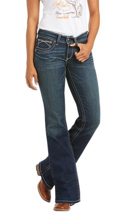 Ariat R.E.A.L. Mid Rise Stretch Whipstitch Bootcut Jeans for Ladies are tough enough for your workday, but finished with whiskering, fading, and fashion stitching so you can wear them everywhere. These Ariat riding jeans are made of stretch denim to fit your body perfectly, and they hold that fit without sagging in the seat or gapping in the waist. They have a medium wash, 5 pockets, a zip-and-button fly, and a mid-rise waist to give you coverage when you're active. Ariat R.E.A.L. Mid Rise Stret Western Style Mid-rise Dark Wash Flare Jeans, Western Style Dark Wash Mid-rise Flare Jeans, Western Mid-rise Denim Blue Jeans, Western Style Straight Leg Flare Jeans In Medium Wash, Jeans For Ladies, Capsule Wardrobe Casual, Ariat Jeans, Riding Jeans, Pocket Jeans