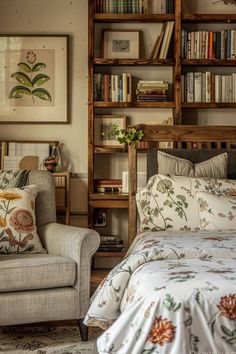 a bedroom with a bed, chair and bookshelf filled with lots of books