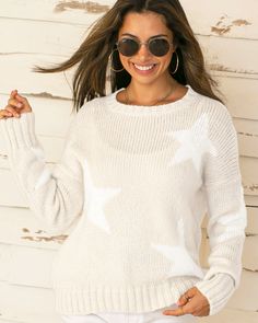 A must-have boyfriend crew, this sweater is super soft and knit in a flattering, relaxed fit. It features a star graphic knit into the body and sleeves. Details include ribbed finishes on the neckline, cuffs, and hem. The dropped shoulders add extra slouch and enhance the relaxed fit. Composition: 76% Acrylic, 12% Mohair and 12% Wool White Star Print Sweater For Fall, Casual V-neck Chunky Knit Sweater, Trendy Long Sleeve Chunky Knit V-neck Sweater, Fall White Sweater With Star Print, Casual Fall Sweater With Star Print, White Sweater With Star Print For Winter, Brown Chunky Knit Cotton Sweater, Casual Crew Neck Sweater With Star Print, White Winter Sweater With Star Print