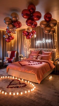 a bedroom decorated for valentine's day with candles and balloons