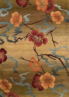 an area rug with flowers on it in brown and orange colors, along with blue water