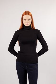 "Black knit turtleneck sweater for women HELGA Stay warm and stylish with HELGA's 100% merino wool turtleneck sweater. Its long sleeves, ribbed texture, and cozy feel make it the perfect addition to your wardrobe. Material: 100% merino wool Color: black Available sizes: XS, S, M, , XL Features: - ribbed; - fine knit;  - turtleneck; - long sleeves;  - soft and comfy; - great piece of your wardrobe in winter as well as springtime. our model Dana is 1.73 m / 5'67\" and wears size S. You may also be interested in black turtleneck sweater with thumb openings: https://www.etsy.com/listing/511503285/turtleneck-sweater-womens-wool-sweater www.kristaelsta.com" Merino Wool Turtleneck Polo Sweater, Winter Merino Wool Ribbed Turtleneck, Ribbed Merino Wool Turtleneck For Winter, Ribbed Merino Wool High Neck Turtleneck, Black Turtleneck Polo Sweater, Black Turtleneck Polo Sweater For Winter, Black Merino Wool Turtleneck Top, Black Fine Knit Turtleneck Sweater, High Neck Fine Knit Merino Wool Turtleneck