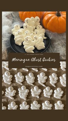 some white ghost cookies sitting on top of a table next to pumpkins and other halloween decorations