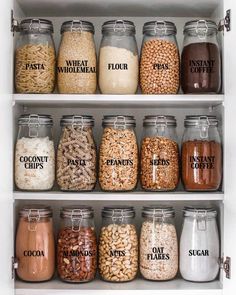 an organized pantry filled with lots of different types of beans and cereal in glass jars