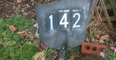 an old mailbox with the number 124 on it