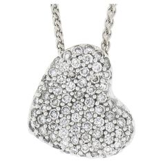 This gorgeous diamond heart pendant necklace was crafted from solid 14k white gold and is drenched with fine quality diamonds throughout. The heart is slightly concaved and domed in some parts, and is entirely covered with round brilliant diamonds that total approximately 1.0 carats in weight, displaying spectacular amount of brilliance with fiery effects seen with every movement for a truly glamorous look. Enjoy! --Stone(s):-- Numerous Natural Genuine Diamonds - Round Brilliant Cut - Pavé Set - Diamond Heart Pendant Necklace, Heart Pendant Diamond, G H, Diamond Heart, Quality Diamonds, Heart Pendant Necklace, Pave Diamonds, Round Brilliant, Chain Lengths