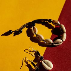 Channel the beauty and symbolism of African culture with the Ozo Cowrie Shell Bracelets. Traditionally known to represent wealth, fertility, and protection, these bracelets are hand-strung by skilled artisans, incorporating natural cowrie shells and durable materials. Perfect for stacking or wearing solo, the Ozo Bracelets add a touch of tradition and elegance to your everyday style. Each bracelet reflects the rich cultural history of African craftsmanship, making it a meaningful accessory or gi Symbol Of Wealth, Cowrie Shells, Shell Bracelet, Cowrie Shell, African Culture, The Coast, Fertility, Shells, Bracelet