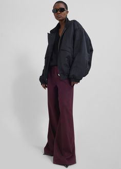 Color: Burgundy Midweight woven fabric Regular fit Wide leg Mid-rise Belt loops Side seam pockets Back illusion welt pockets Zip fly Asymmetric front button closure Unlined 77% Polyester 21% Rayon 2% Elastane Dry Clean By The Frankie Shop. Imported The Frankie Shop, Frankie Shop, Wide Leg Trousers, Welt Pockets, Welt Pocket, Woven Fabric, Mid Rise, Wide Leg, Dry Clean