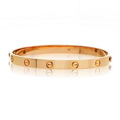 Cartier Love 18K Rose Gold Size 20 Bangle Bracelet. 100% Authentic preowned. Old model where the screws come out. Center Diamond Weight: 0.00Metal Type: 18K Rose GoldMetal Weight: 36.6 gr.Signed: CartierCondition: Excellent.Stock: RR9516 Cartier Gold Bangle Bracelet For Wedding, Cartier Gold Jubilee Bracelet For Wedding, Cartier Gold Bracelet With Polished Finish For Wedding, Rose Gold Polished Bangle For Wedding, Rose Gold Bangle With Polished Finish For Wedding, Cartier Gold Bracelet With Polished Finish For Anniversary, Designer Rose Gold Bangle, Modern Rose Gold Wedding Bracelet, Luxury Rose Gold Bangle For Anniversary