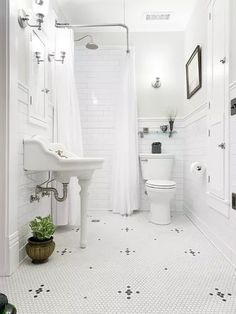 a white bathroom with the words vintage master bath