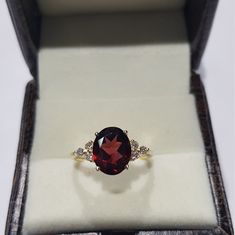 14k solid yellow gold natural garnet semi precious gemstone and natural round brilliant cut shaped diamonds gemstones ring. 1. The weight of the natural garnet gemstone used in the ring =3.10 cts. 2. The weight of the natural diamonds gemstones used in the ring =0.18 cts. 3. The weight of the 14k solid yellow gold used in the ring =2.534 grms. The garnet is the birthstone for the people born in the month of January. The ring is absolutely stunning and gorgeous. I have used all my skills and expe Formal Garnet Birthstone Ring In Fine Jewelry Style, Formal Garnet Birthstone Ring Fine Jewelry, Heirloom Garnet Oval Birthstone Ring, Formal Garnet Birthstone Ring, Formal Round Birthstone Ring With Gemstone Accents, Gold Garnet Jewelry With Diamond Accents, Elegant Garnet Ring With Rose Cut Diamonds, Oval Cubic Zirconia Diamond Ring With Gemstone Accents, Oval Cubic Zirconia Ring With Gemstone Accents