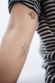 a woman's arm with a tattoo on it that reads, i love you