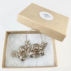 "These earrings are made from a vintage silver dish which had a beautiful embossed around the edge of flowers and other art nouveau motifs. I followed the line of the pattern into a point, drilled it and attached a sterling silver ear wire which is attached to either side of the charm. One side is hooked and unloops from the other side for you to insert the ear wire, and then clip it back up. They are very lightweight but are so eye catching. Measurements: Charm Length: 53 mm / 2.08\" Charm Widt Engraved Small Hoop Earrings As Gift, Engraved Small Hoop Earrings For Gift, Vintage Hoop Earrings For Gift, Vintage Hoop Earrings For Gifts, Vintage Hoop Earrings As A Gift, Vintage Silver Hoop Earrings For Wedding, Vintage Hoop Earrings With Lever Back For Gifts, Vintage Metal Hoop Earrings As Gift, Vintage Small Hoop Jewelry Gift