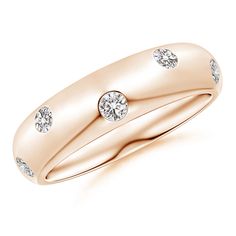 a yellow gold wedding ring with three diamonds