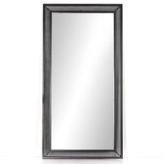 a black framed mirror hanging on the wall