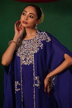 Ink blue kurta featuring floral pearl and bead hand embroidery on the neckline. Paired with an embroidered cape and a solid flared pant. - Aza Fashions Indigo Traditional Wear For Wedding, Blue Traditional Drape Top For Reception, Blue Tops For Reception With Traditional Drape, Blue Floral Embroidered Kurta For Reception, Blue Floral Embroidery Kurta For Reception, Royal Blue Cutdana Dupatta, Designer Blue Kaftan With Chikankari Embroidery, Blue Kaftan With Chikankari Embroidery For Festive Occasions, Festive Blue Kaftan With Chikankari Embroidery