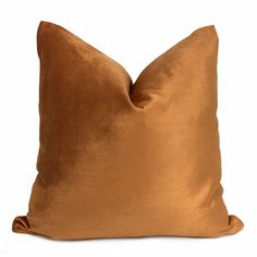 a brown pillow on a white background with no one in the photo to describe it