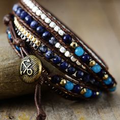 Introducing the Ethnic Blue Chic Wrap Bracelet, a stunning accessory that brings beauty and harmony to your daily life. Crafted with high-quality gemstones, this bracelet exudes a sense of elegance and sophistication, making it a perfect complement to any outfit. Not only does it enhance your appearance, but it also promotes balance and positive energy flow throughout your body. *Material: Jasper, Lapis Lazuli, Jade, Wax rope, Metal *Making Technics: Handmade Sewed *Size: 32.5 inches, 3 closures Jasper Lapis, Energy Flow, Inner Peace, Positive Energy, Lapis Lazuli, Wrap Bracelet, Daily Life, Hand Weaving, Sense