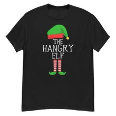 The Hangry Elf Funny Tshirt Christmas Elf The 100% cotton men's heavyweight tee will help you land a more structured look. It sits nicely, maintains sharp lines around the edges, and goes perfectly with layered streetwear outfits. Plus, it's extra trendy now!   * 100% cotton  * Sport Grey 90% cotton, 10% polyester  * Fabric weight: 5.0-5.3 oz/yd² (170-180 g/m²)   * Open-end yarn  * Tubular fabric  * Taped neck and shoulders  * Double seam at sleeves and bottom hem  * Blank product sourced from Honduras, Nicaragua, Haiti, Dominican Republic, Bangladesh, Mexico Elf Funny, Funny Tshirt, Tubular Fabric, Layered Streetwear, Streetwear Outfits, Baseball Shirts, Christmas Elf, Funny Tshirts, Elf