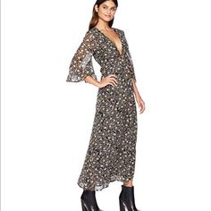 Maxi Dress Features Allover Feminine Floral Print In A Woven Polyester Fabrication. Deep V-Neckline. Knot-Tie Detailing At Front. Three-Quarter Length Bell Sleeves With Ruffle Detail. Back-Zip Closure. Straight Hemline At A Sweeping Length. 100% Polyester. Turn Inside Out And Hand Wash Cold, Hang Dry. Dry Clean For Best Results. Imported. Length: 55 In Chic Flowy V-neck Dress With Floral Print, Spring V-neck Maxi Dress For Date Night, Spring Floral V-neck Dress For Date Night, Floral Print V-neck Dress For Summer Date Night, Summer Floral Print V-neck Dress For Date Night, Bohemian V-neck Dress For Date Night, Casual Maxi V-neck Dress For Date Night, V-neck Floral Print Maxi Dress For Casual Occasions, V-neck Floral Print Maxi Dress For Casual Wear