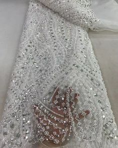 This high quality Fabric is measured in 5 Yards With Embroidered Beading and Sequin. It is soft, very delicate and beautiful. This high Quality Fabric is made with Fashion embroidered rhinestones can be used in making party wedding dresses, skirts, shawls, scarves and other other fashion apparels as you would like. Size : Length : 5 yards (180 inch). Width: 50 inch (Please allow slight deviation for the measurement data ,±1 inch) Material: 100% Polyester, Tulle Lace Fabric, Eco-Friendly embroidery Gold Lace Fabric, Beaded Lace Fabric, Nigerian Lace, Beaded Tulle, African Lace, African Beads, Sequins Embroidery, Sequin Beading, Sequin Fabric